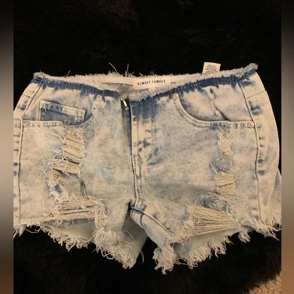 Low rise , stone washed denim shorts. Size 1.
